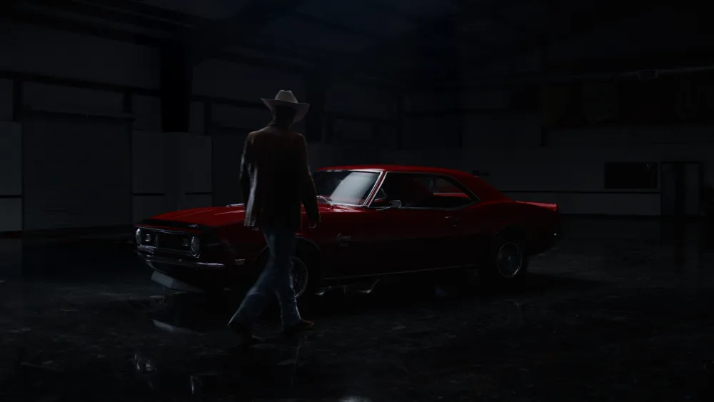A cowboy walking toward a red Camaro